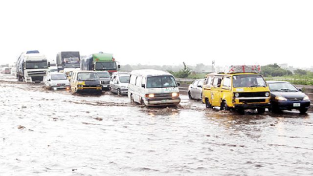 Vehicles on flooded road in Ibadan